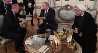 Başkan Erdoğan, Putin ve Ruhani'ye ikram etti